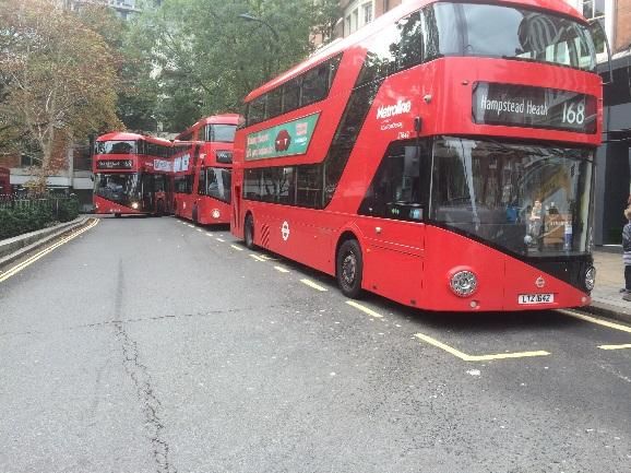 A double decker buses parked on a street Description automatically generated