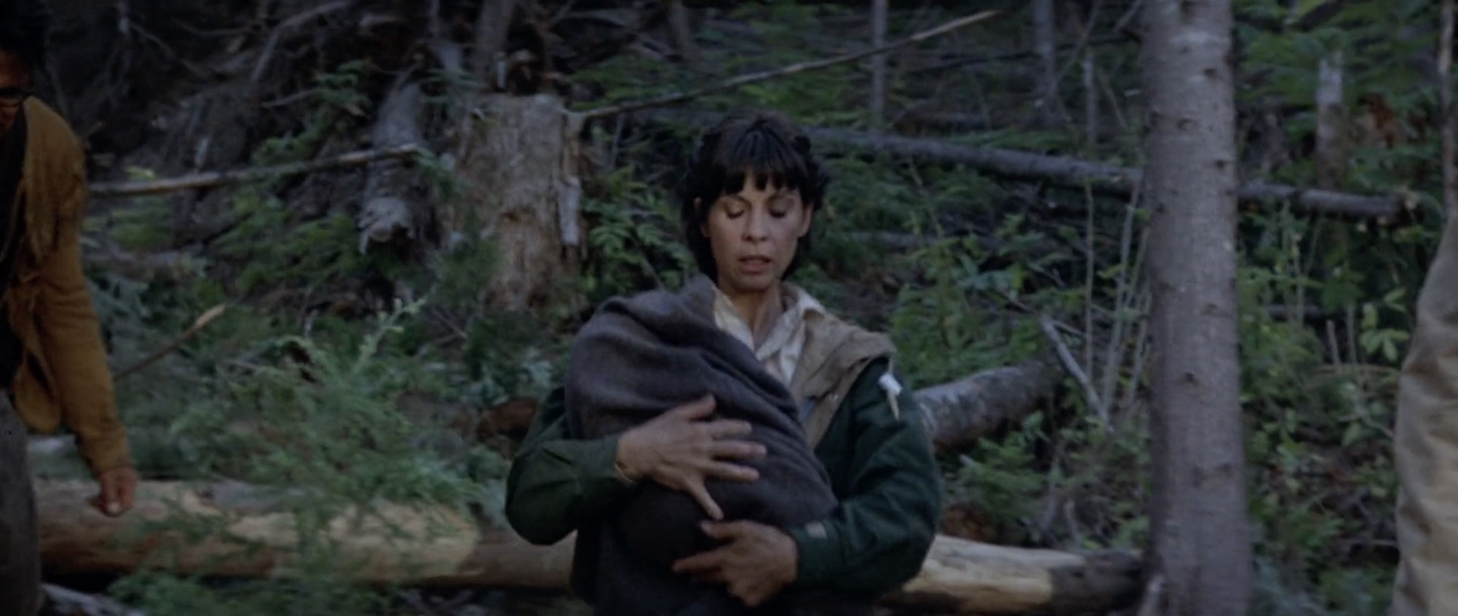 There’s a whole, I wouldn’t call it a subplot, but a bit where Maggie takes care of the mutant cub, reflecting her desire to be a mother and the possibilty that her unborn child is a monster. It doesn’t go anywhere. The cub ends up biting her while crossing the lake, threatening to drown her. Verne ends up pulling it off her and submerging the creature. Written out, that sounds like the film taking a stance, but it never feels like that in the movie, just another incident.