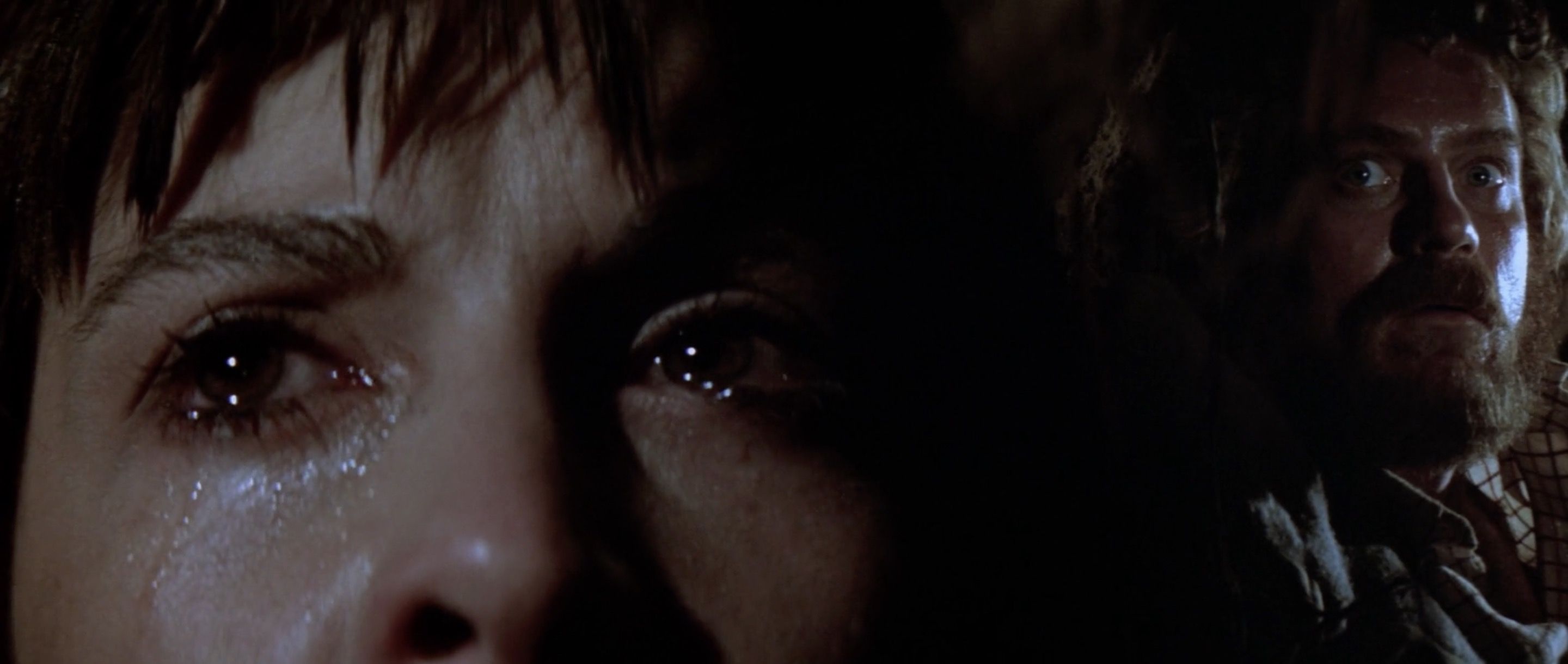 The group hides from the bear in a small underground dugout. Frankenheimer conveys the entire suspense sequence with a series of split diopter shots like this one. It looks good, or at least interesting, at first, but there’s so many of them it becomes funny.