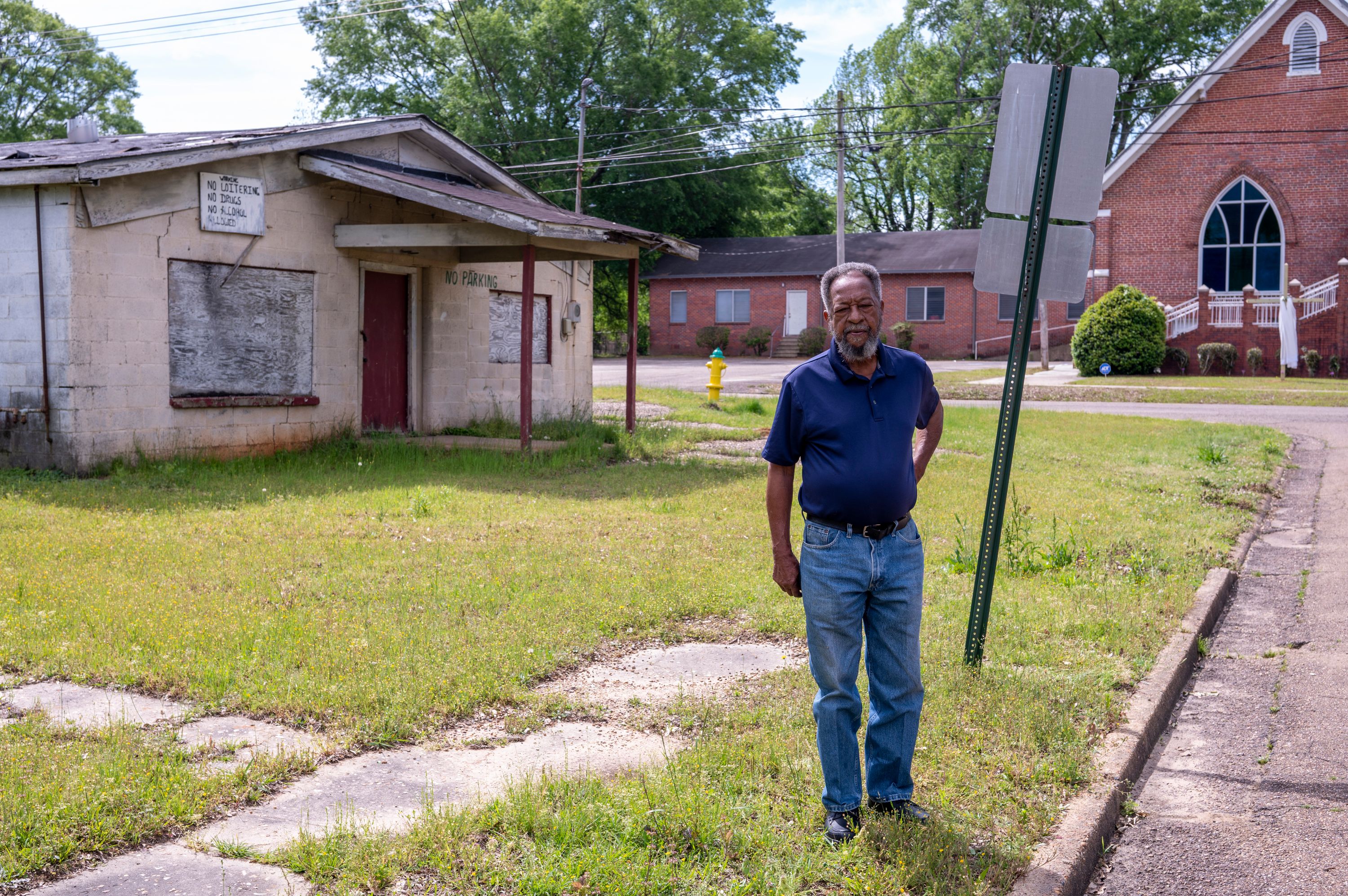 Bill Smith stands on Jones Street in Ruston, Louisiana, in front of the former cafe, near the spot where John Wilder was killed. Photo by Ben Greenberg