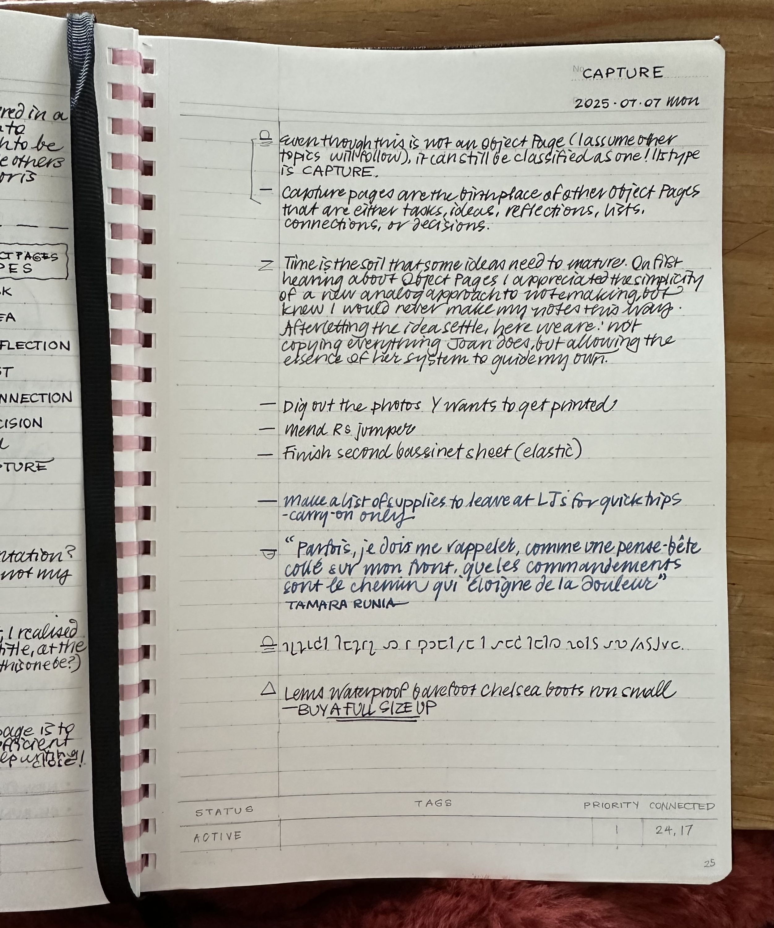 open notebook with random handwritten notes, with the word CAPTURE at the top and a metadata section at the bottom