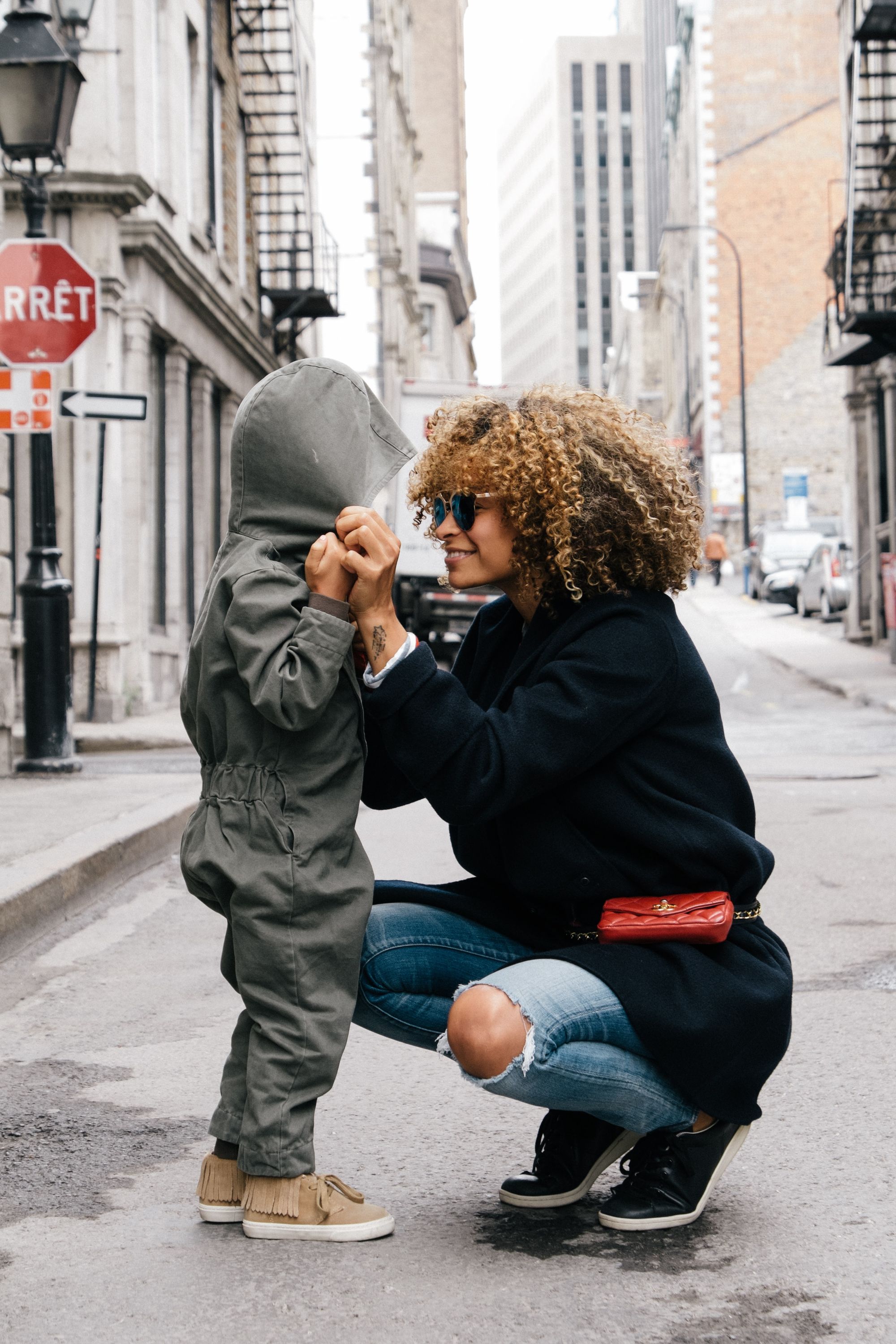 Mother with small child on city street