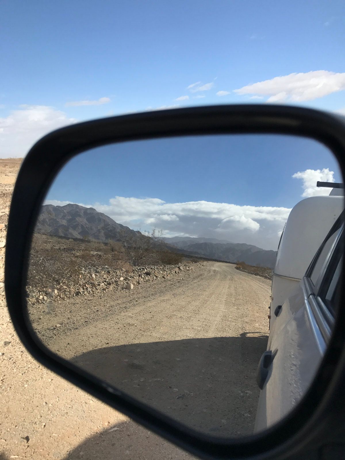 slow long drive down washboarded road in the desert (2017)