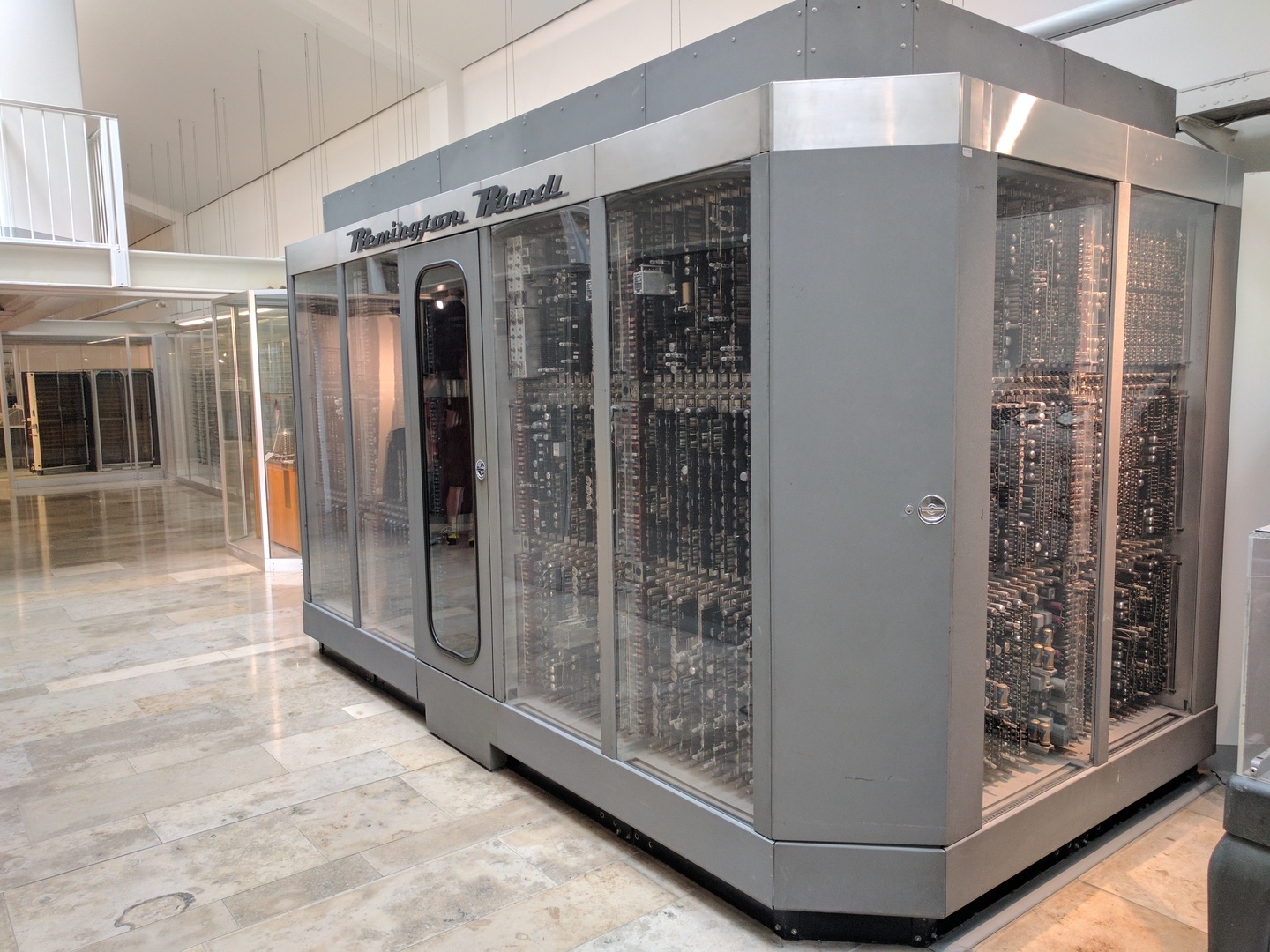 13:00:56: “Series production of universal computers began with the UNIVAC I; the first model was begun in 1949 and completed in 1951. Altogether 49 of these computer systems were built. The selling price was a million dollars in 1957. The CPU (central processing unit) consists of over 975,000 individual components. Total weight 19 tons. Binary-decimal representation of numbers in excess-3 code; serial processing of the twelve fixed-point decimal digits. Single address instructions. Storage: mercury delay lines. Hardware: 5.600 vacuum tubes, 18,000 diodes, 300 relays. The computer was in operation at the Batelle Institute in Frankfurt from 19th October 1956 until 1963. The peripheral devices are not exhibited.”