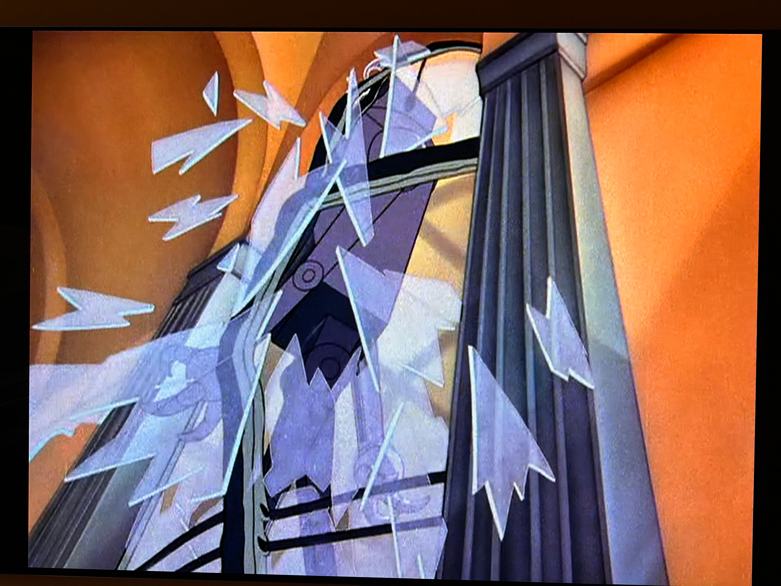 A robot bursting through a glass window from the official DVD