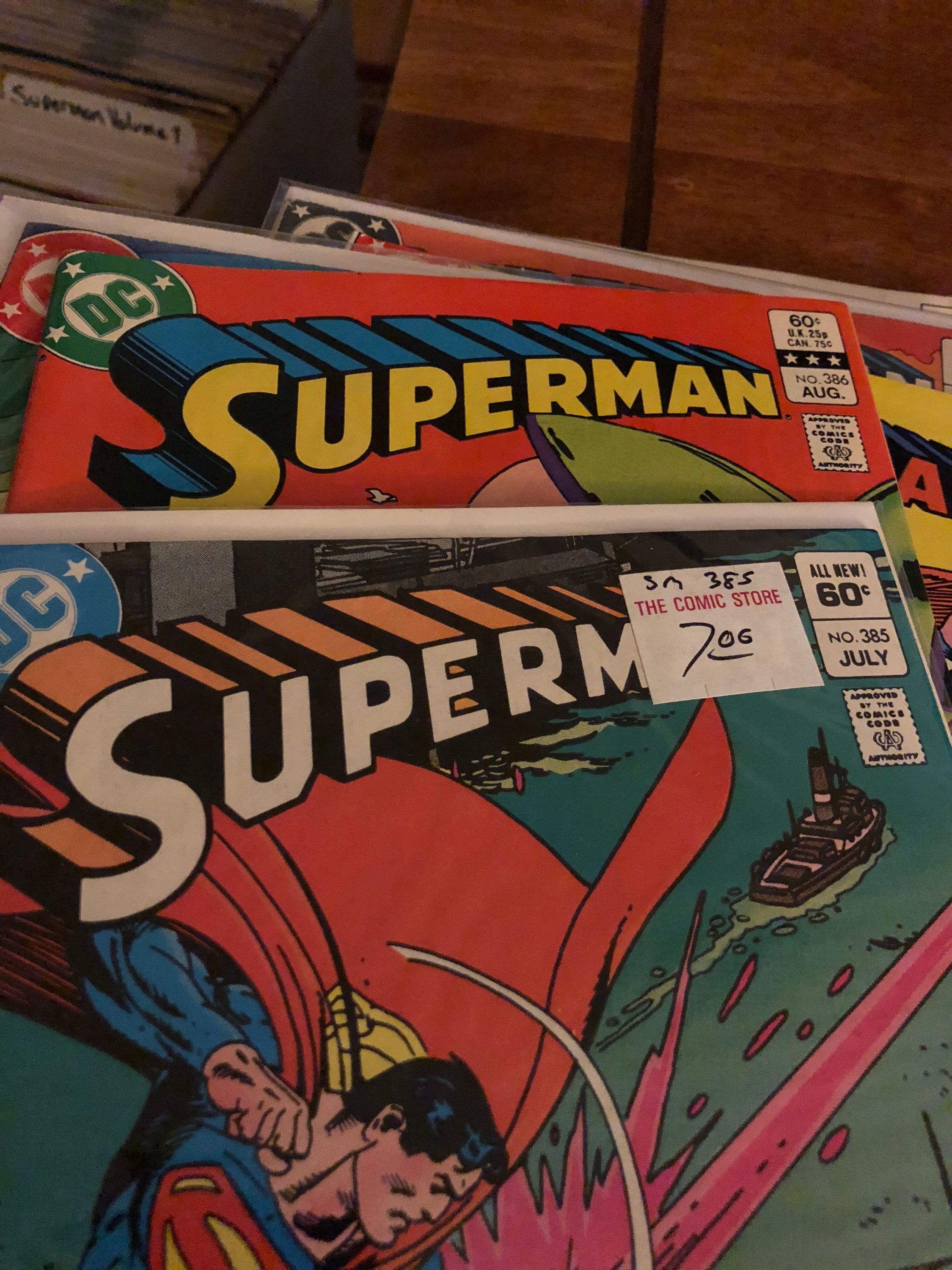 Superman issues 385 and 386 showing the logo transition