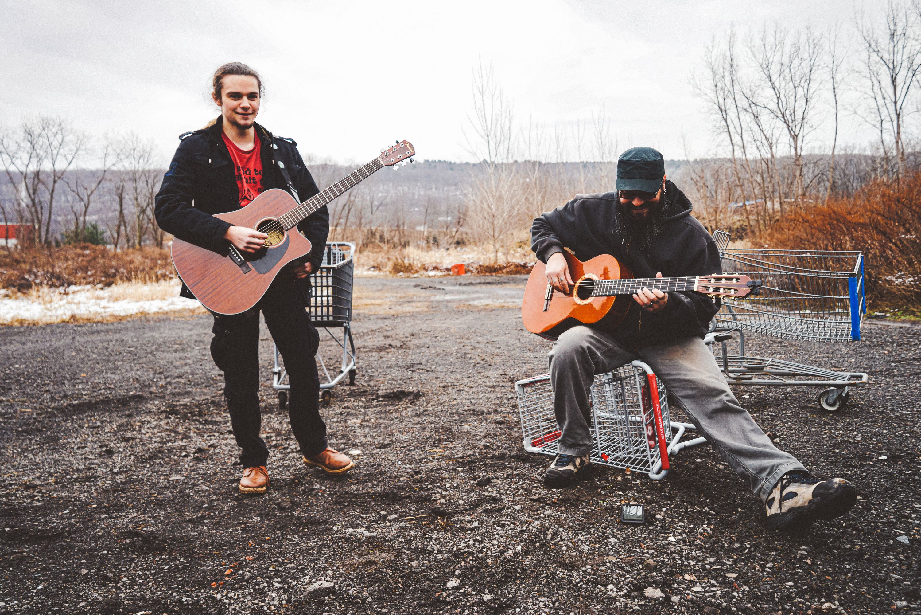 Men Playing Guitars