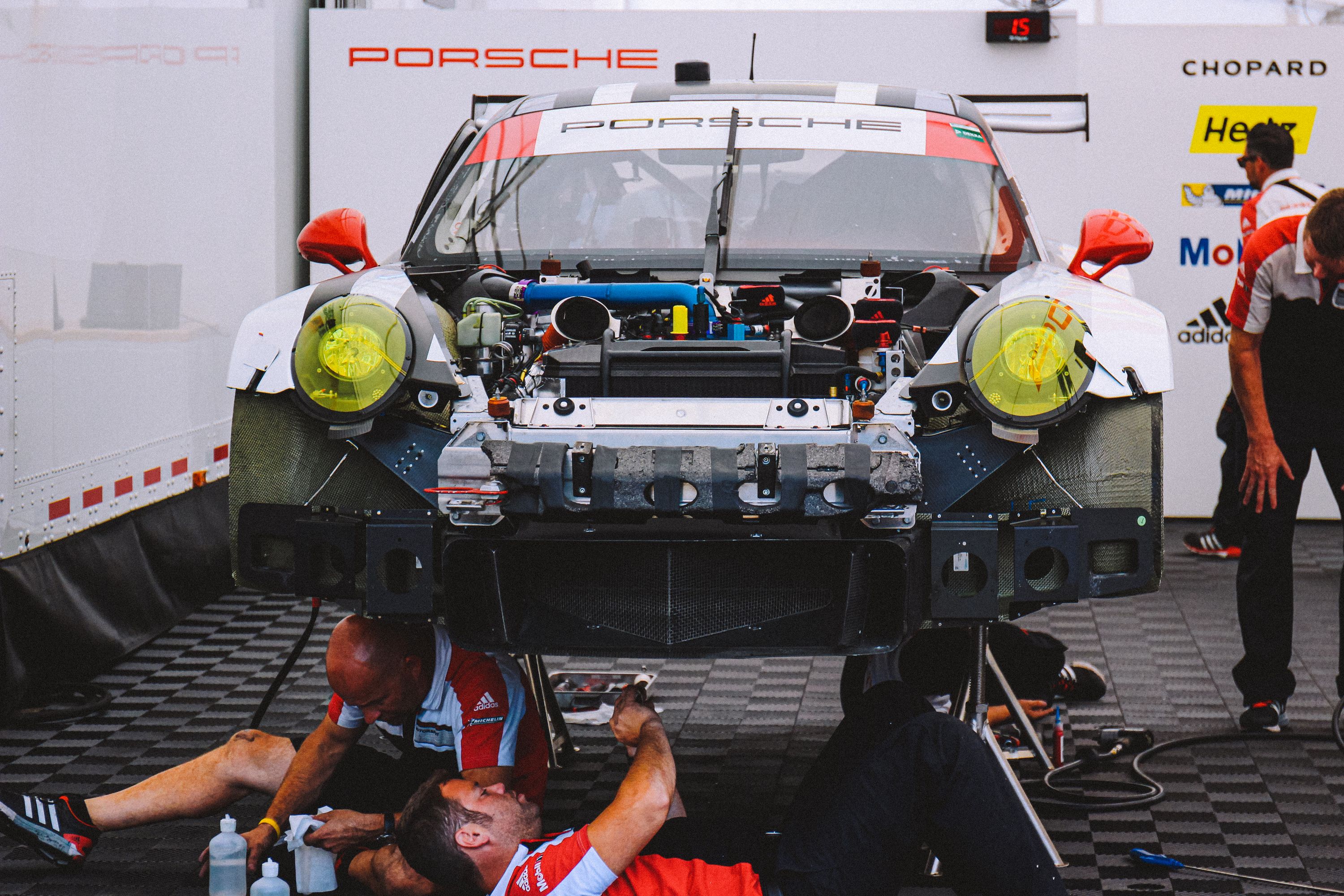 Men Working on Porsche