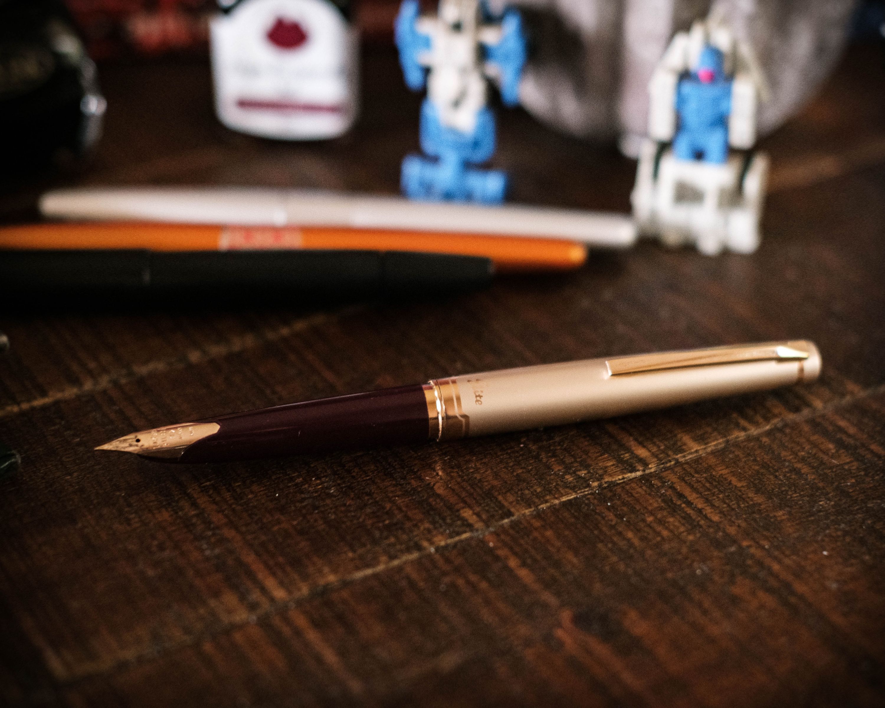 Pilot E95s, burgundy and cream, fine nib.