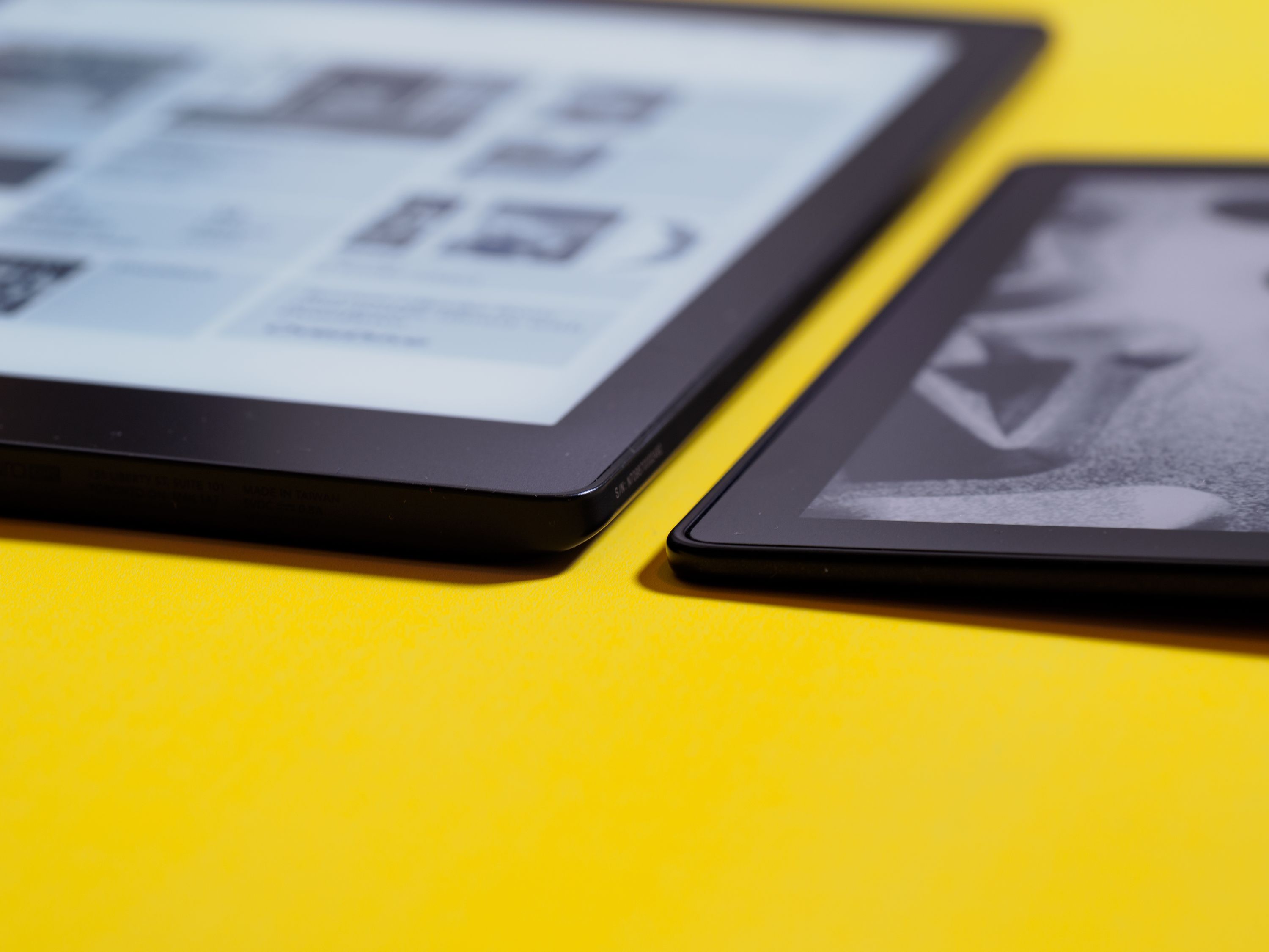 The Kindle Oasis (right) is not only significantly smaller in shape, it’s also thinner along its tapered edge. The button side is about the same thickness as the Aura One (left).