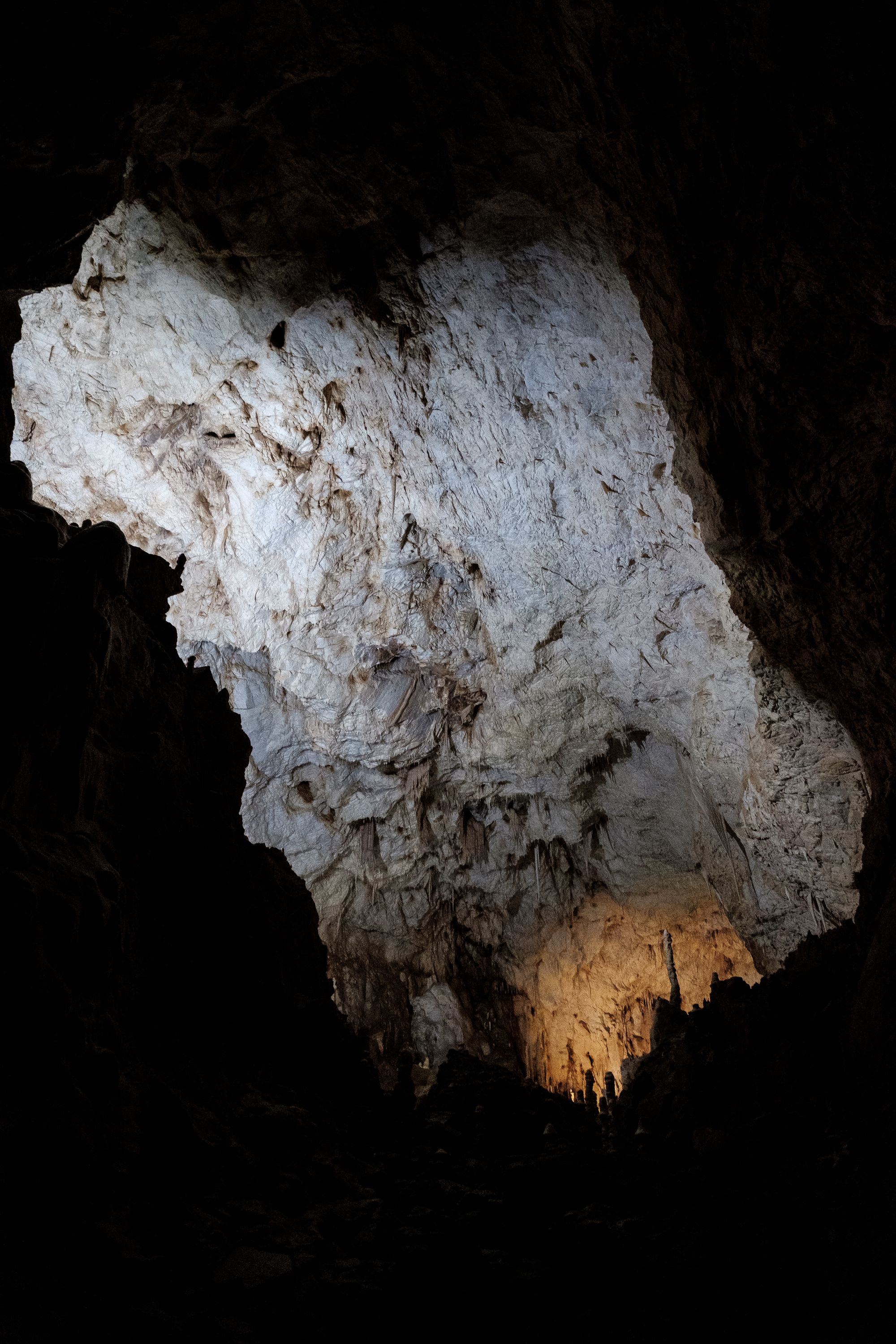 The stalagmite near the orange light is as tall as I am. It takes about ten years for a single centimetre of limestone to accumulate. Fujifilm X-Pro 2 + 14mm: 1/18 @ ƒ/2.8 ISO 6400