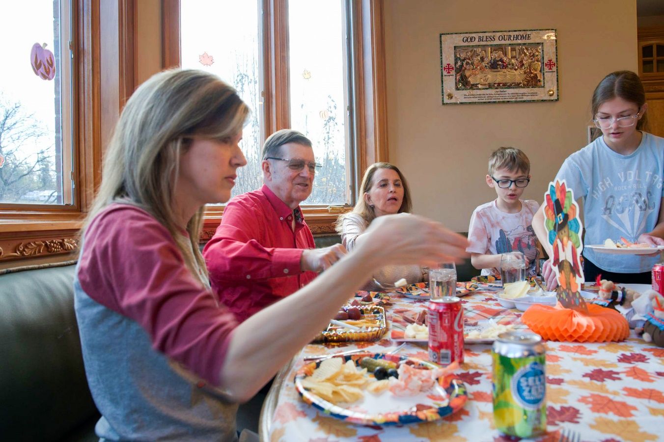 A group of people sitting at a table Description automatically generated