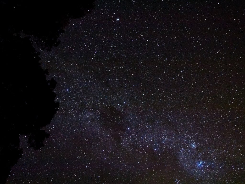 A picture of the night sky, with the Milky Way across it from the right corner and going up and to the left.