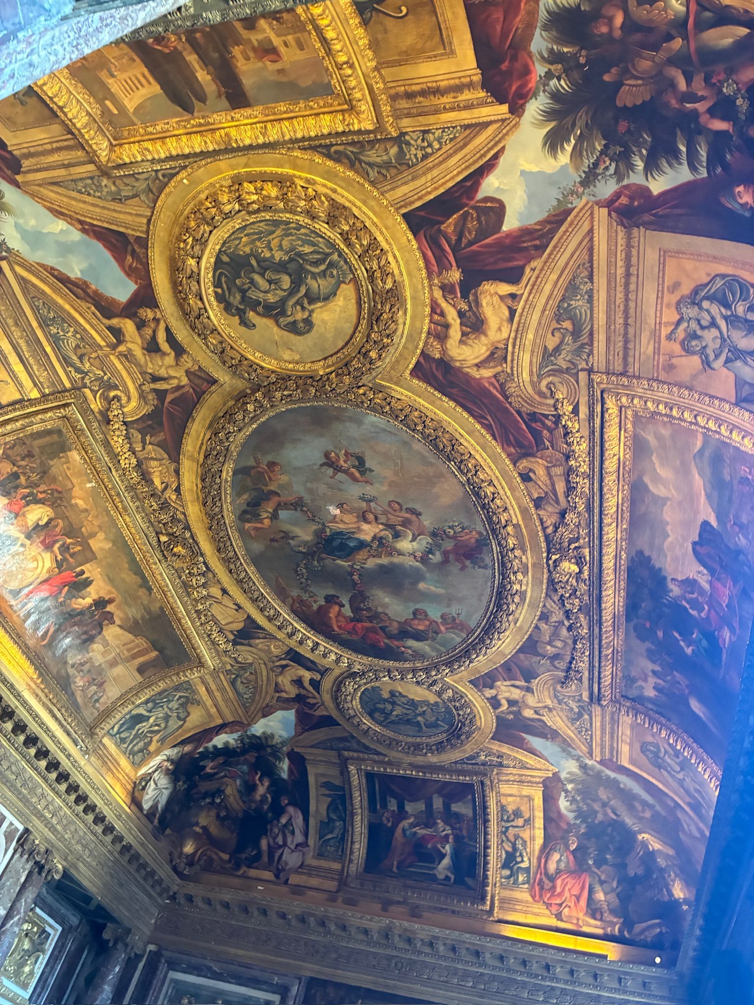 A ceiling with gold and gold painted walls AI-generated content may be incorrect.