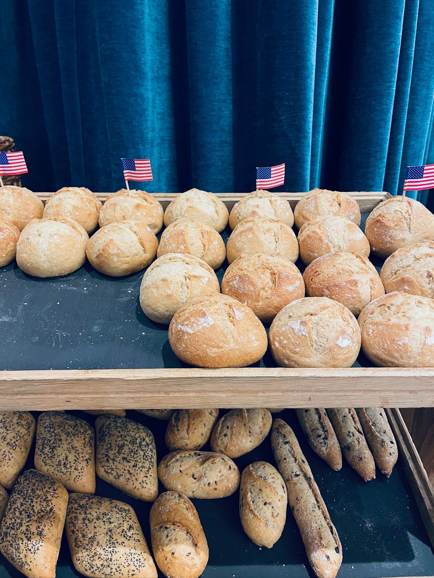 A tray of bread on a shelf AI-generated content may be incorrect.