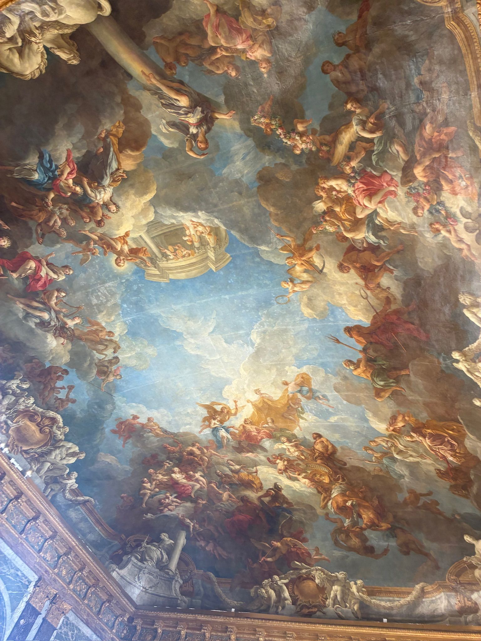 A ceiling painting of a painting of angels and people AI-generated content may be incorrect.