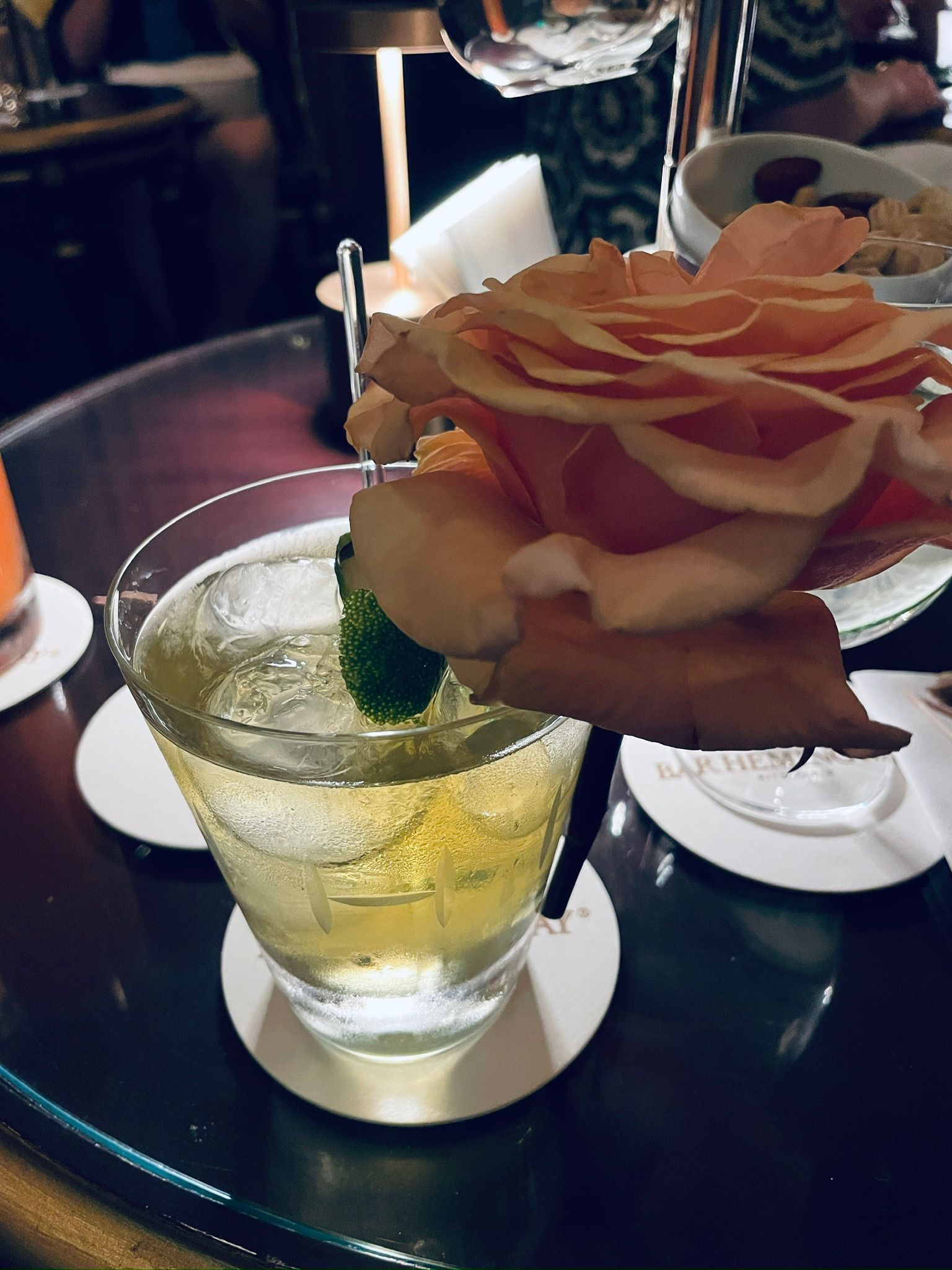 A glass with a flower in it AI-generated content may be incorrect.