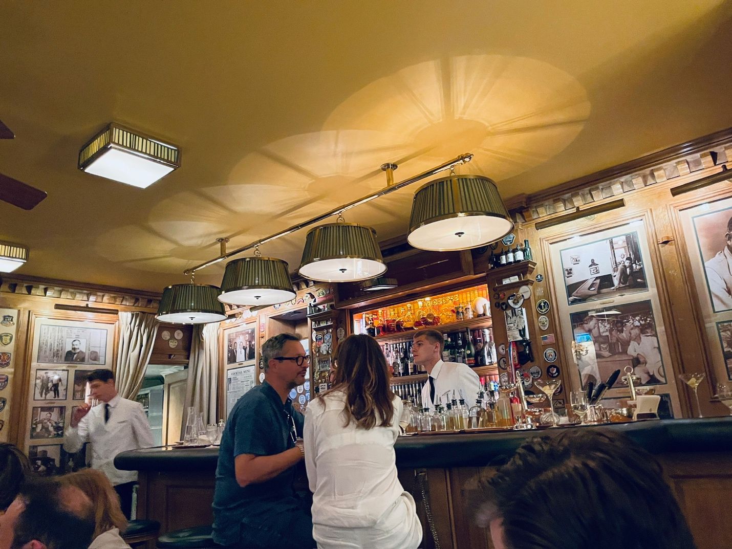 People at a bar AI-generated content may be incorrect.