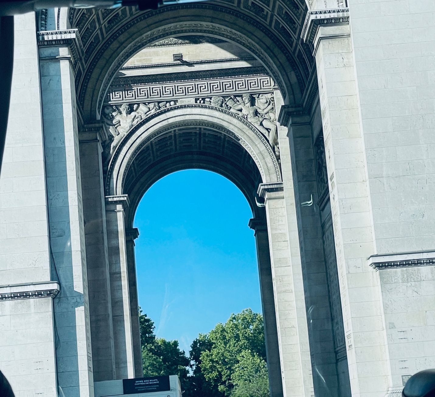 A large stone archway with a blue sky AI-generated content may be incorrect.