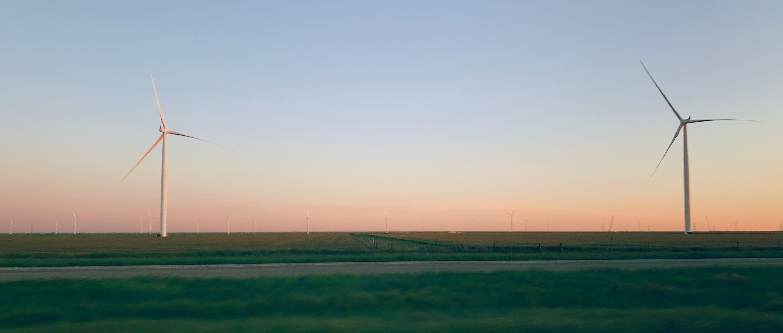 Some windmills in Texas near dusk