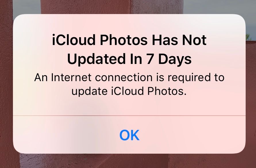 The alert says “iCloud Photos Has Not Updated In 7 Days”