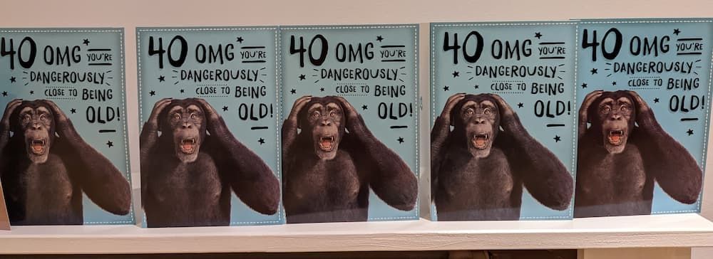 5 birthday cards each showing the same chimp