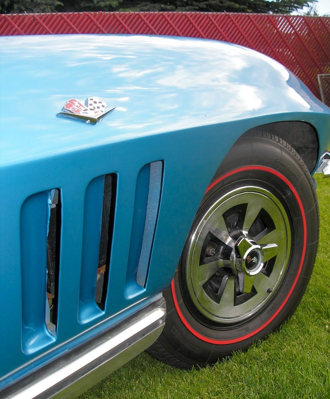 A close-up of a blue car Description automatically generated