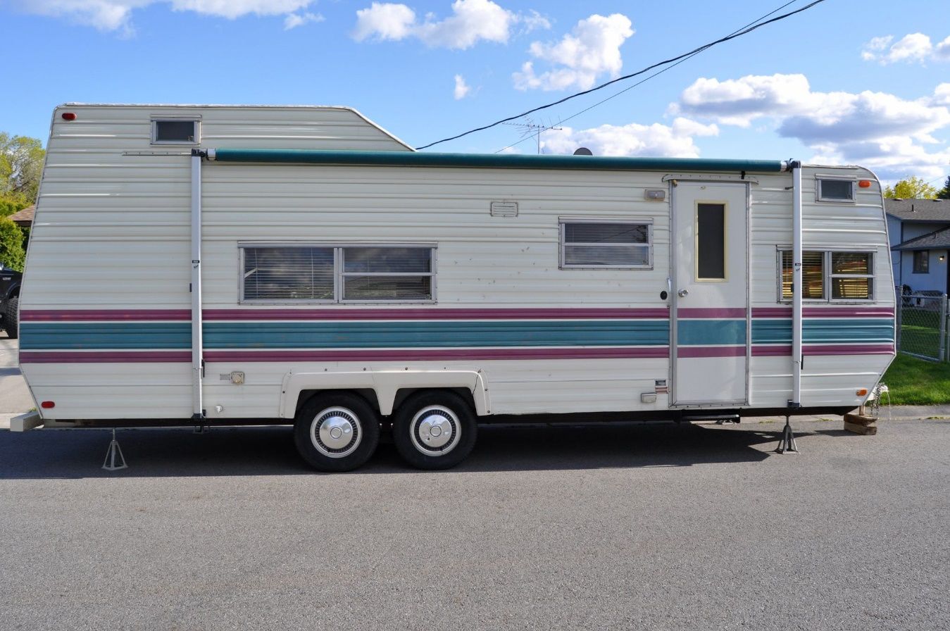 A trailer parked on the road Description automatically generated