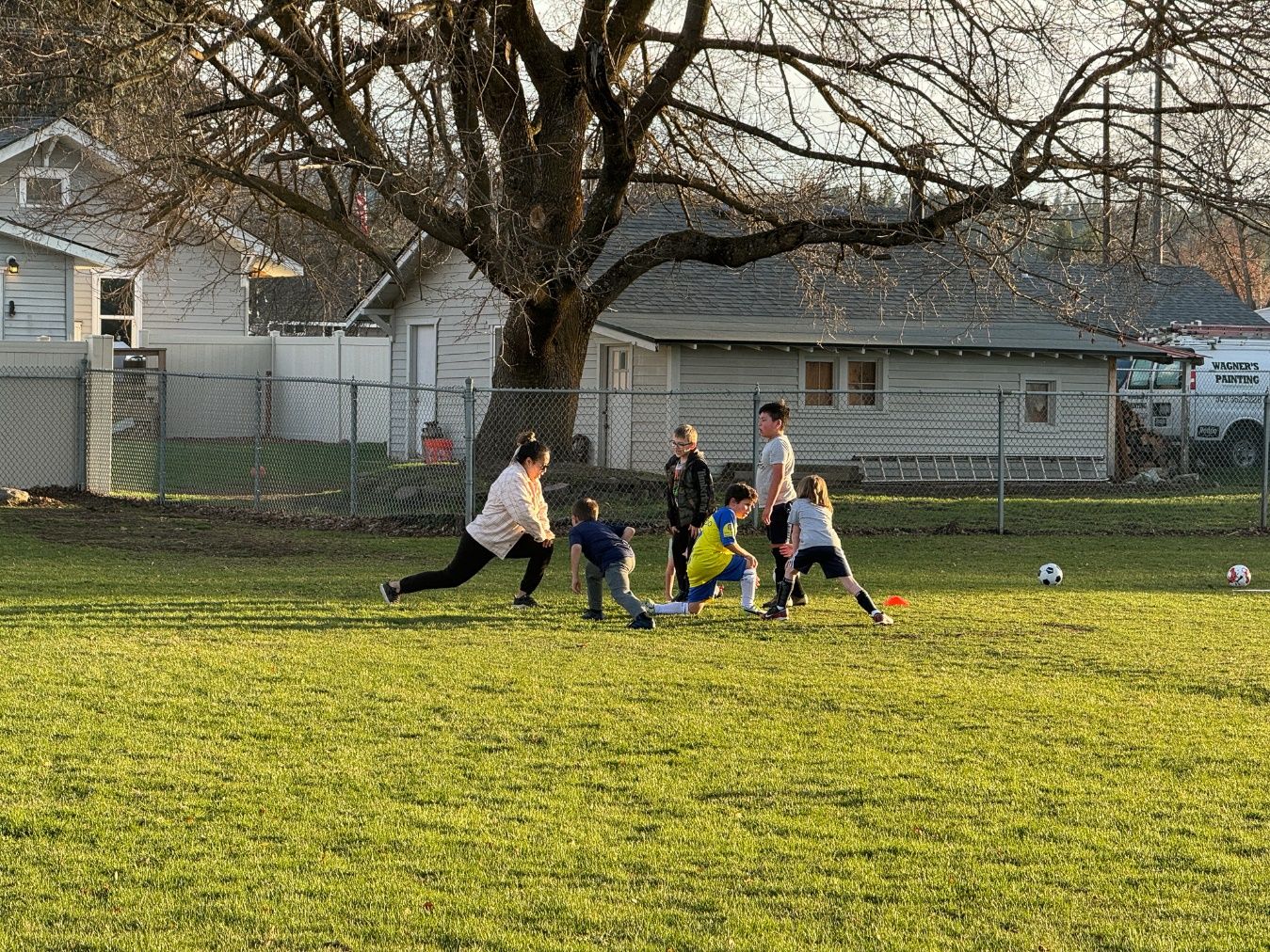 A group of people playing football Description automatically generated