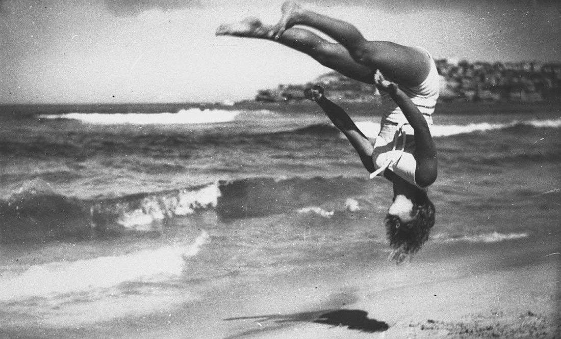 Peggy Bacon in mid-air backflip (Copyright-free image from The State Library of New South Wales)