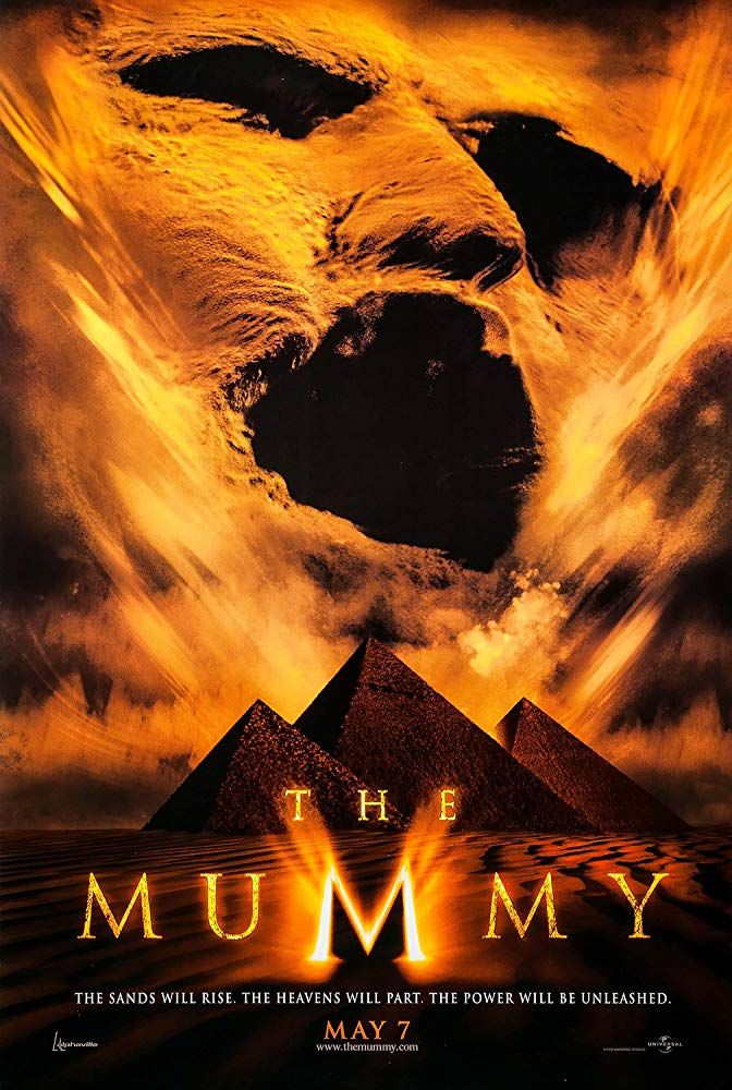 A theatrical poster for The Mummy: a great face of sand in the sky over the great pyramids of Egypt. Tagline: “The will rise. The heavens will part. The Power will be unleashed. May 7.”