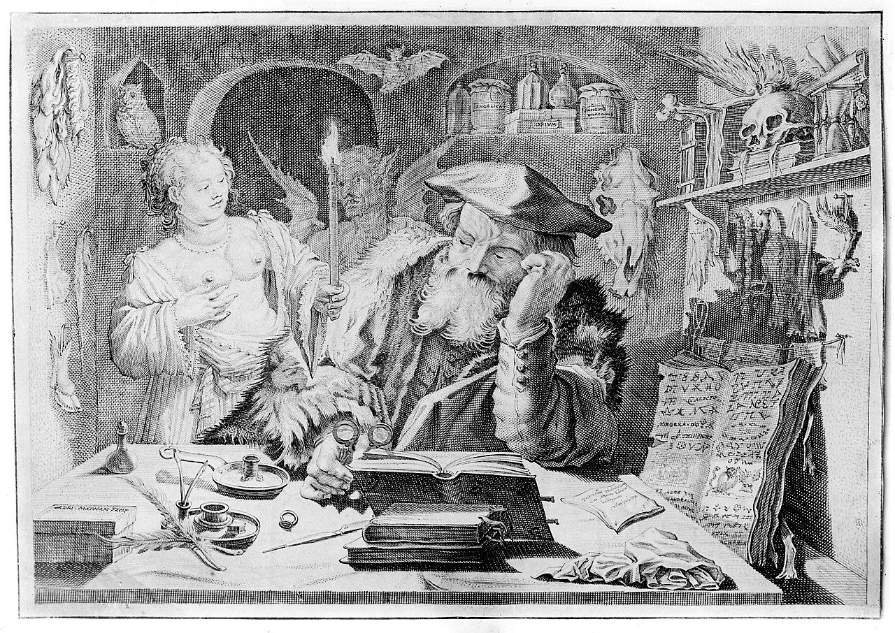 A large-bearded man at a desk peers over his shoulder at a topless woman and a devil causing some ruckus behind him. He is attempting to read a large book, and the room is decorated with more books, as well as skulls, jars, and devices.