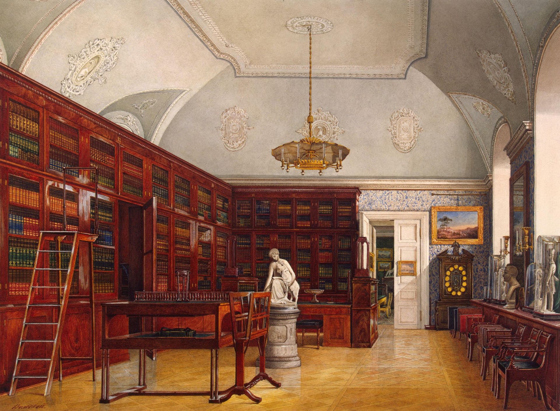 Bookshelves dominate the center of this white arched room, with small marble statues, a desk, and some chairs filling the rest of the space. Illumination comes from tall windows on the right-hand wall.