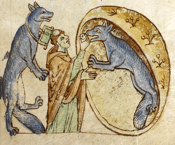 An illustration from an illuminated manuscript. A central monk raises a cracker to the mouth of a bipedal dog creature on the right, which is within some kind of cave or bowl. Behind him on the left, another of the creatures is standing on one foot.