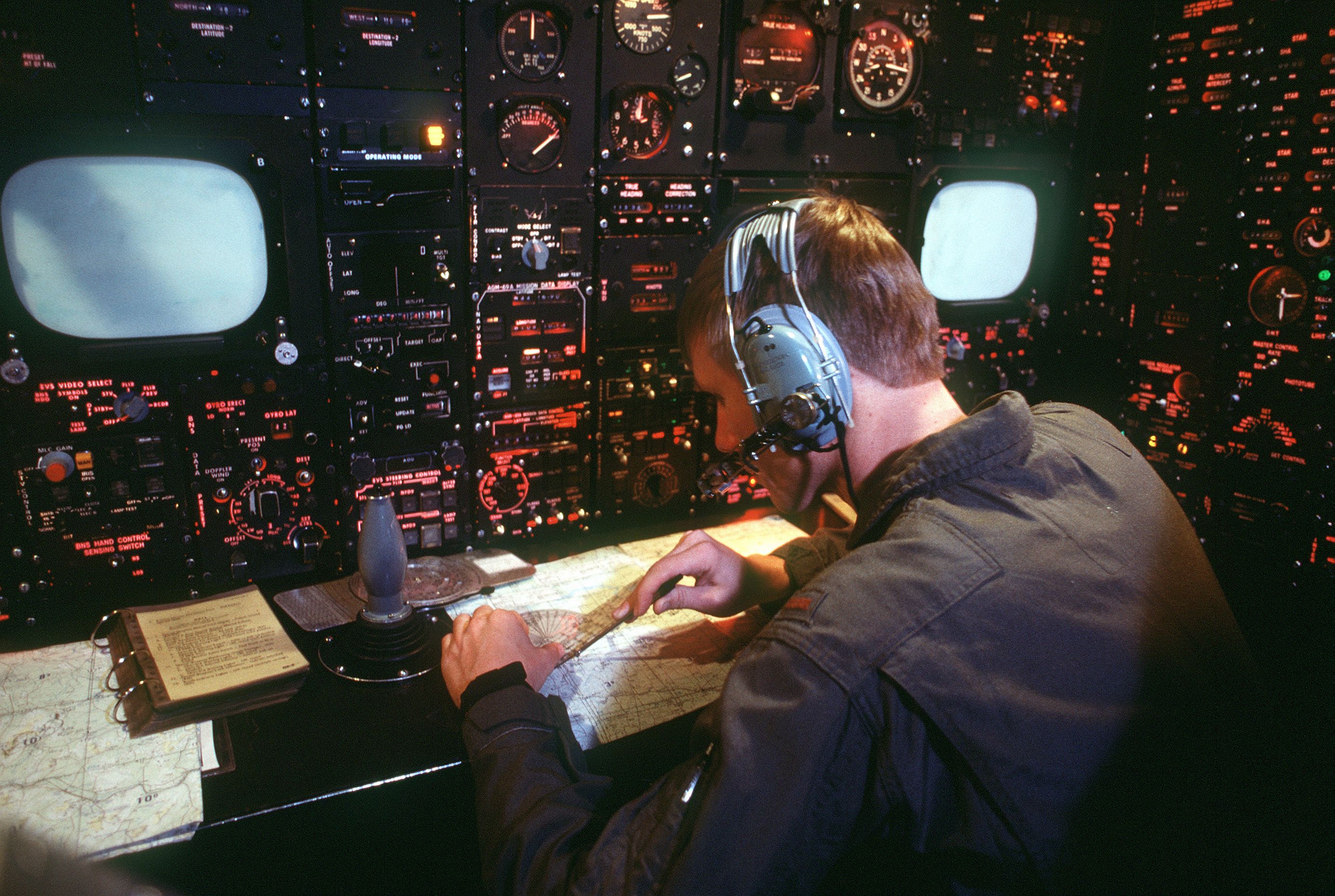 “A student enrolled in the Air Training Command Undergraduate Navigator Course uses a T45 navigational simulator system during a class. The T45 uses high-speed computers to provide a realistic ground-based simulation of a wide variety of navigational situations.”