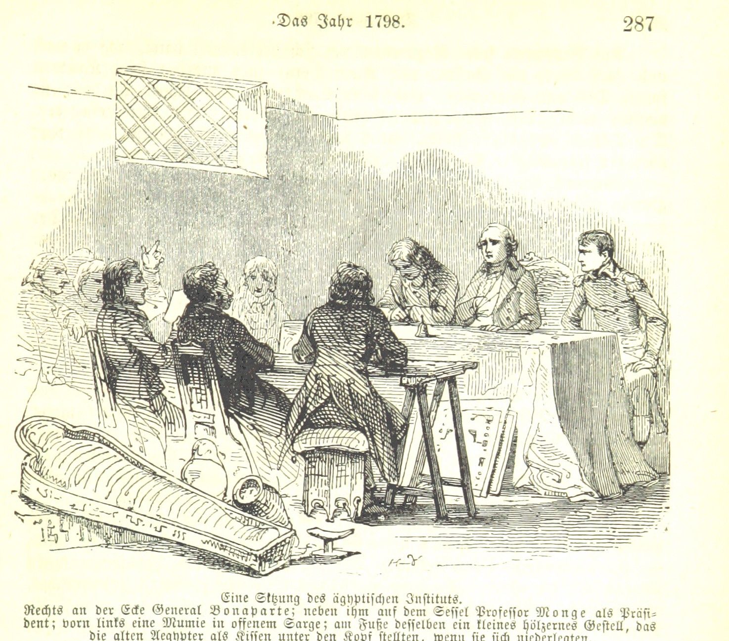 A black and white illustration of a group of uniformed men seated at a long table. In the foreground, a mummy in its sarcophagus and some other assorted urns and such. The caption is in German.
