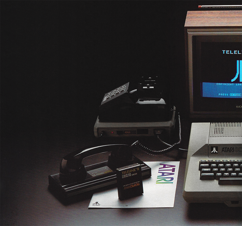 The Atari 800 connects to an Atari 850 interface, which links to the Atari 830 acoustic modem; the Bell 301 phone’s handset couples to the Atari 830, enabling communication. Pictured alongside is an Atari Telelink II Computer Communications software.