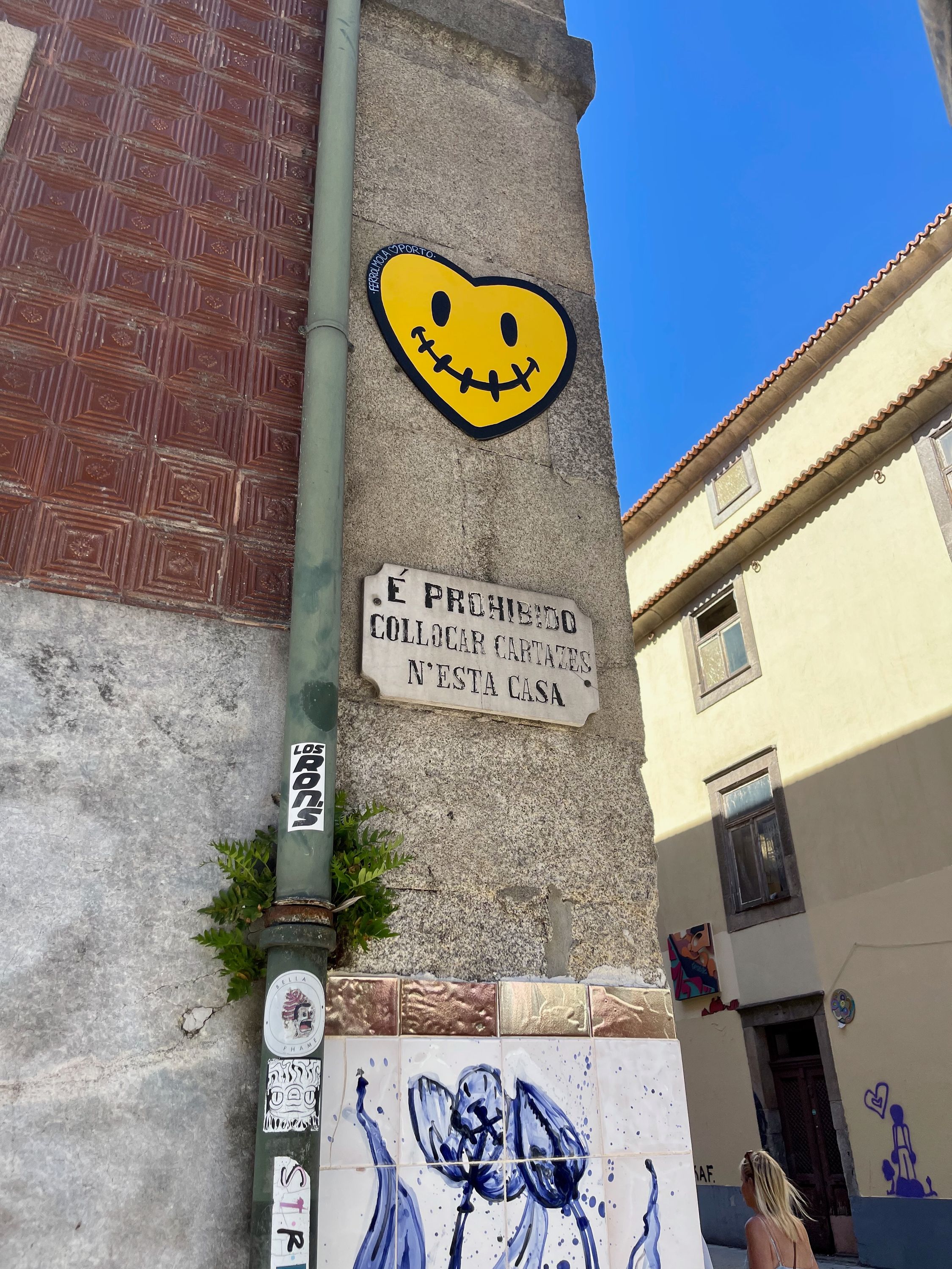 yellow-smiling-heart-street-art-in-porto-portugal