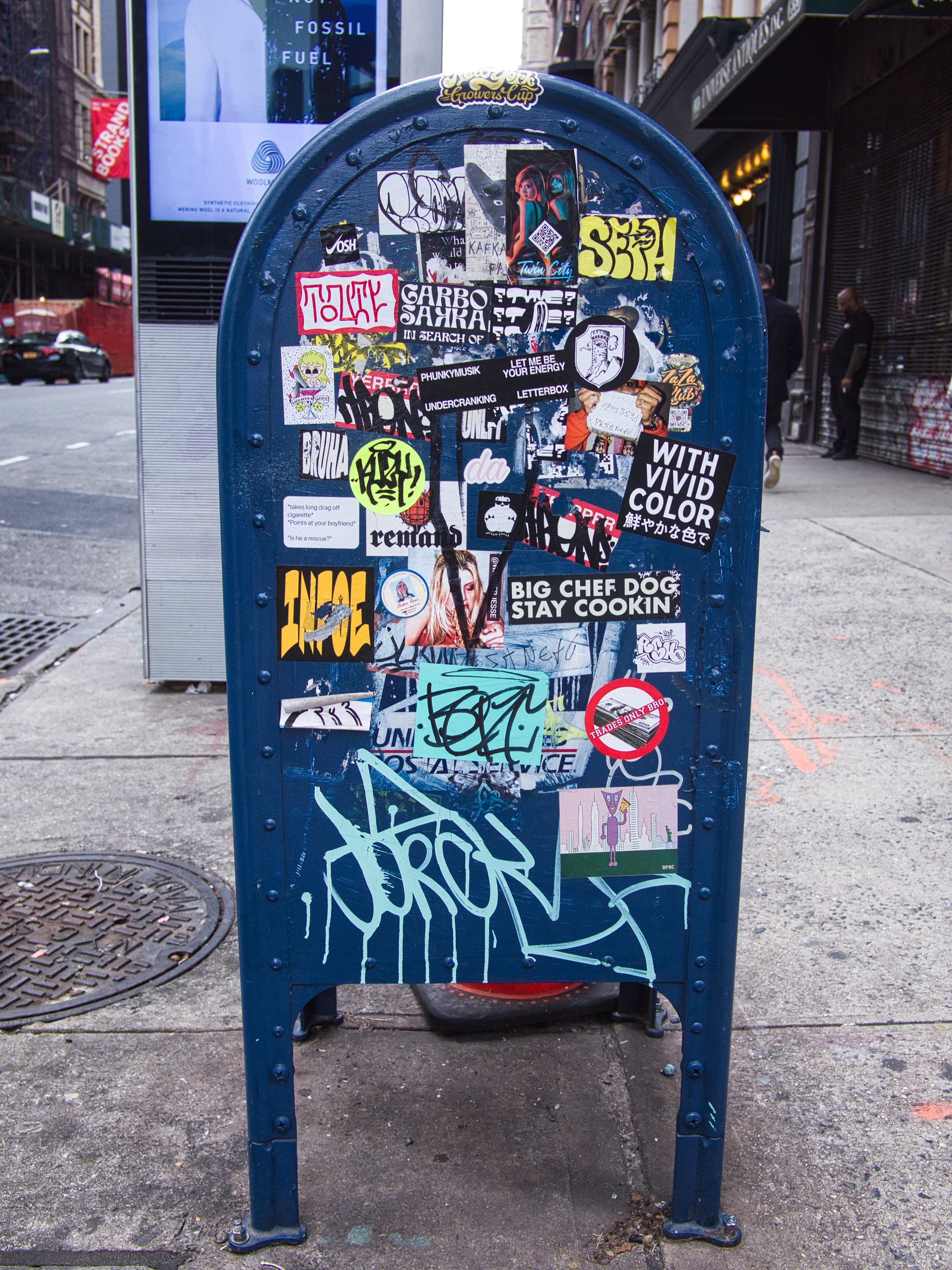 blue letter box with stickers in nyc