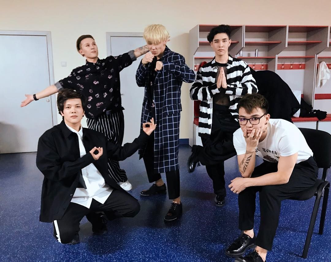 Picture of Ninety One striking silly poses with serious looks on their faces, downloaded from Instagram at some point, probably 2017 judging from the hair and tattoos