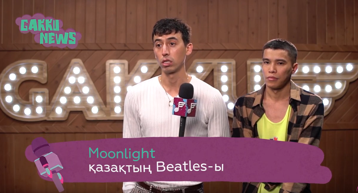 Image of Ansat and Azamat being interviewed, with a caption that says (I think) “Moonlight: Kazakhstani Beatles”