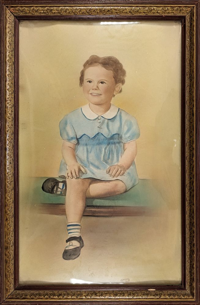 Image of a young girl about 4 in a light blue dress with a white collar