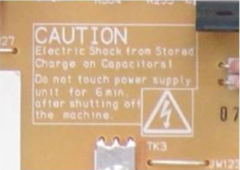 CAUTION: Electric shock from charged capacitors