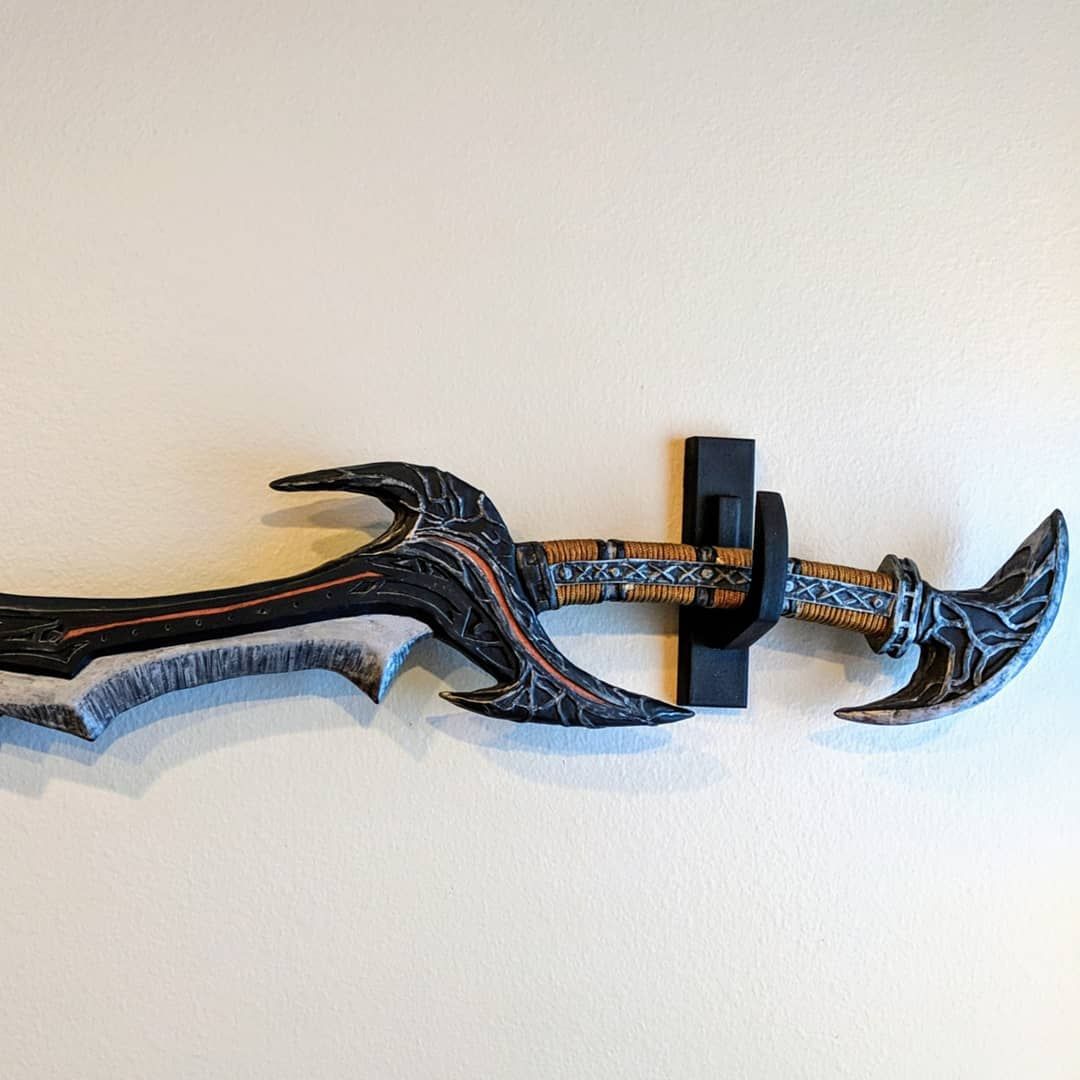 I almost forgot that in between waiting for the glue to dry in the bowed lyre, I dashed out some sword hangers to get some of my swords out of the corner! Not bad for a few minutes work with MDF. ramdomprojects swordhanger