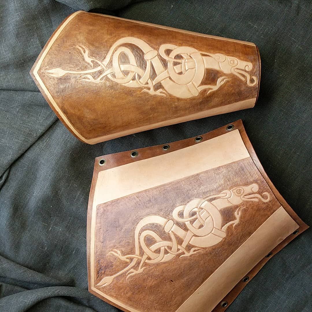 Second set of Ranger bracers are done! Bracers of the dragon to give my arrows fire and the piercing power of a dragons claw! I’ve been working on these for what seems like forever. We threw in a move to a new home and work shop which was like moving 2 houses..we’ve only unpacked about a house and a half… But projects must go on, fellnfair calls us to Olaran to serve with the Rangers! larp larparmor leatherwork leather archery