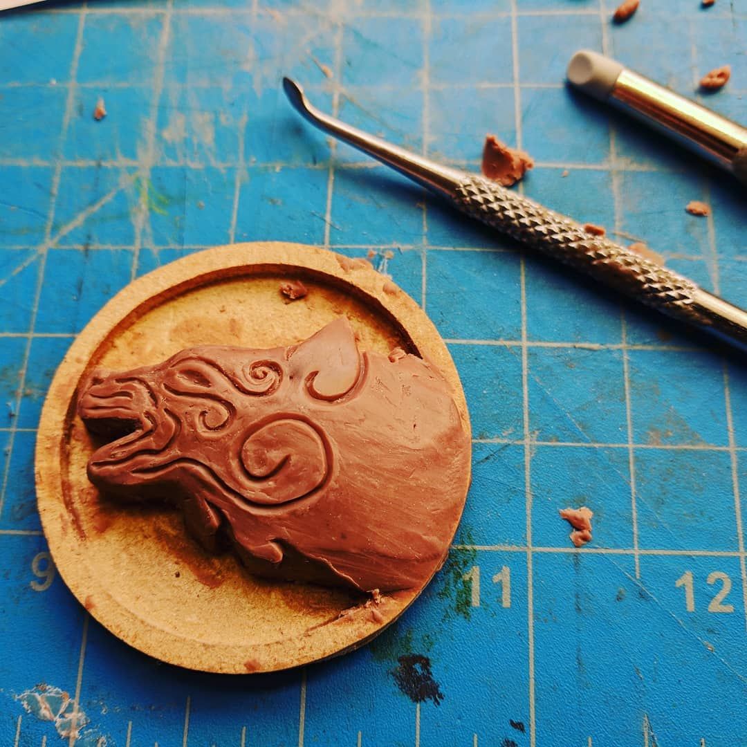 I’m delving into the pewter again! I’m working on a set of fantasy wolf cloak clasp. This one looks about half done. The end result should be 2 wolves facing each other when the class is closed. I’m hoping it will look like a full moon once cast in pewter, we shall see! cloak larp cosplay sculpture jewelry