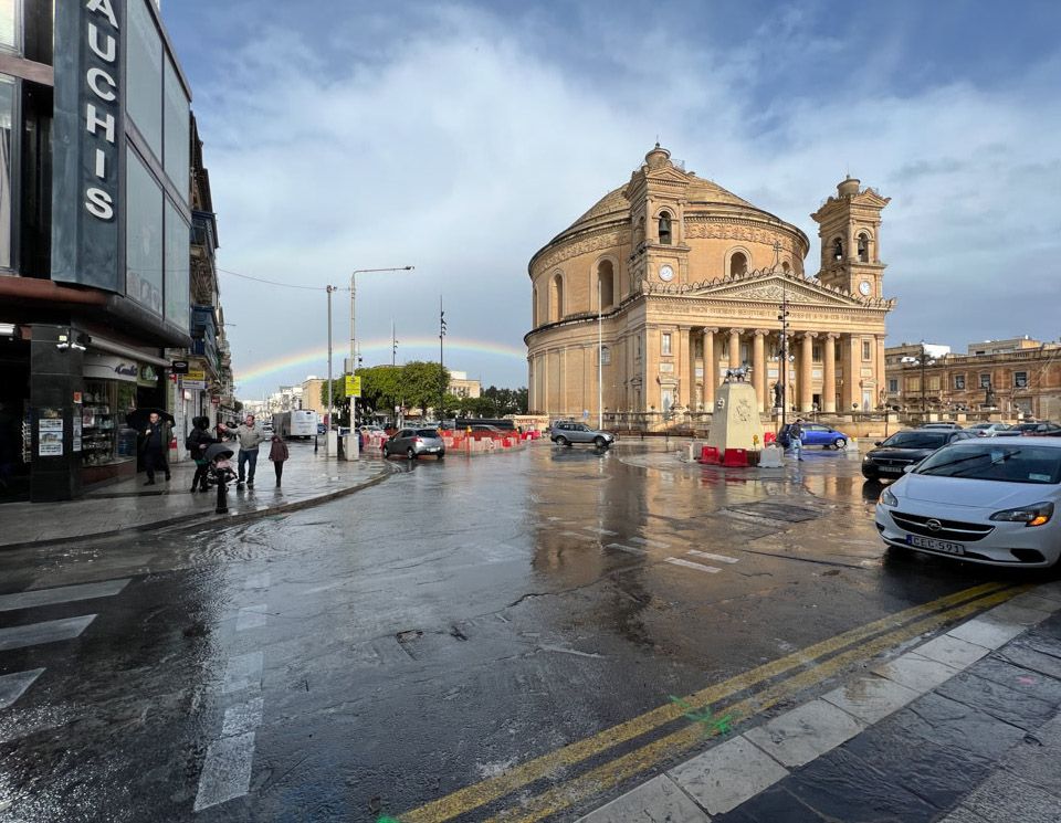 The Rotunda of Mosta with a rainbow next to it