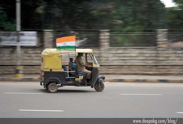 Pan shot of an auto with the Indian tricolor