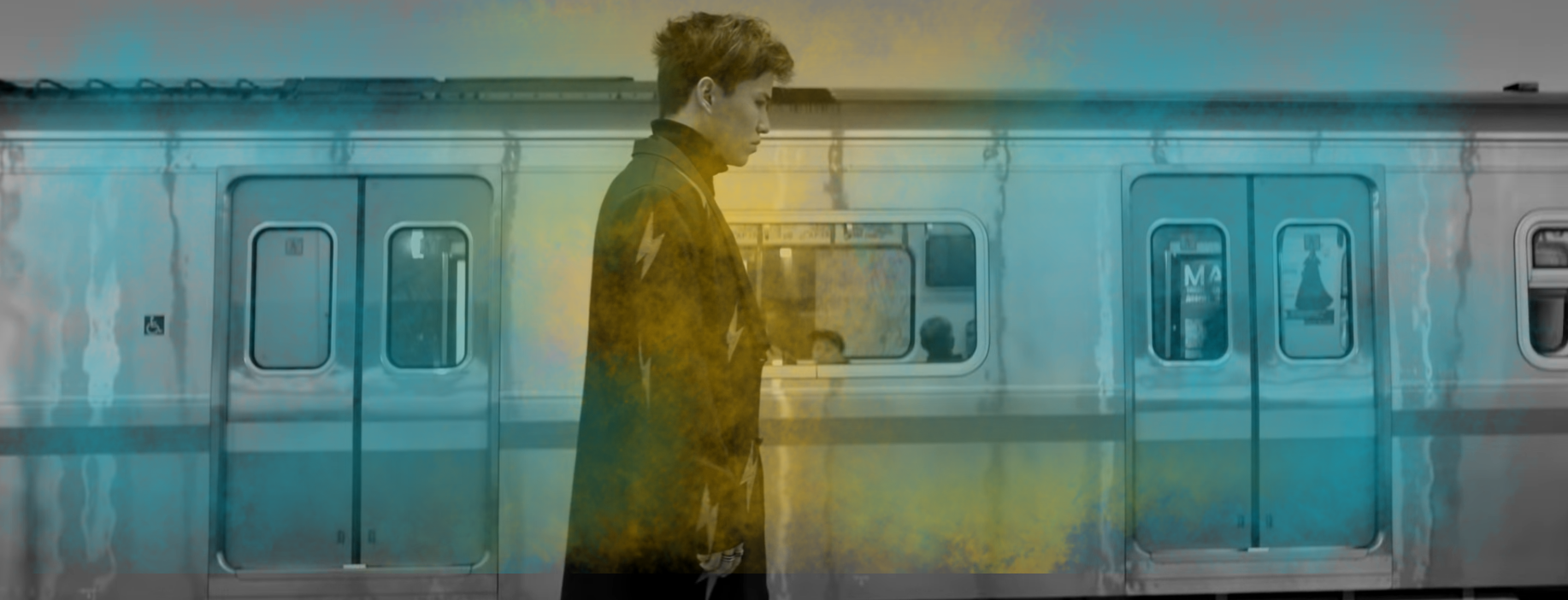 Image of Alem standing in front of a subway train in the “Kaytadan” video