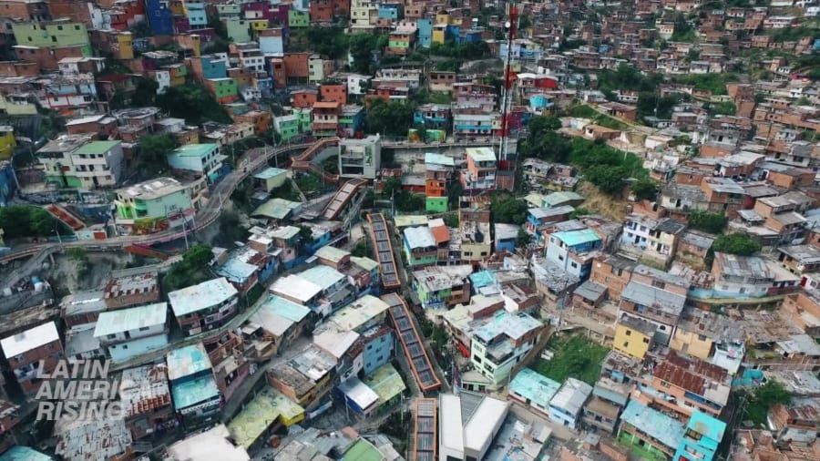 The escalators that transformed the neighborhood (credits to CNN)